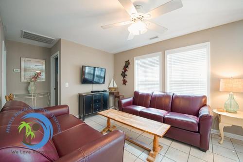 a living room with a couch and a table at Sandcastle Up in Myrtle Beach