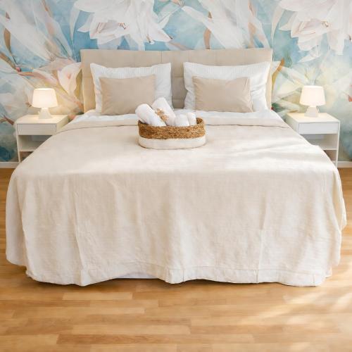 a bedroom with a bed with two towels on it at Suites in Mödling in Mödling
