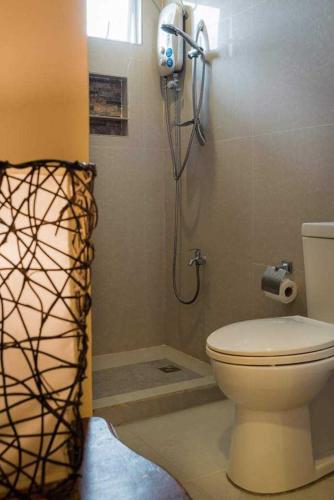 a bathroom with a toilet and a shower in it at West Peninsula Villas in Harrison