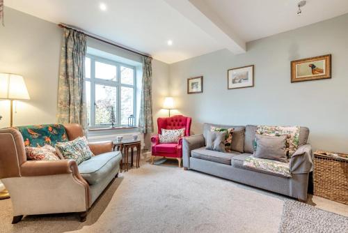 a living room with a couch and two chairs at 3 Bed in Baslow oc-h27288 in Baslow