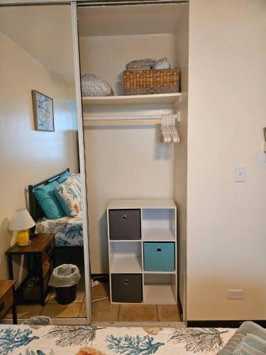 a mirror in a bedroom with a bed at Beach vibes condo in Luquillo in Luquillo