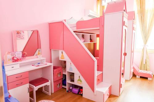 a pink bunk bed with a desk and a mirror at Barbie-Themed 3BDR Penthouse Near The Beach, Nessebar in Nesebar