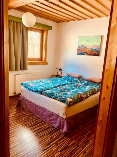 a bedroom with a large bed in a room at Ferienwohnung Oberprossegg in Matrei in Osttirol