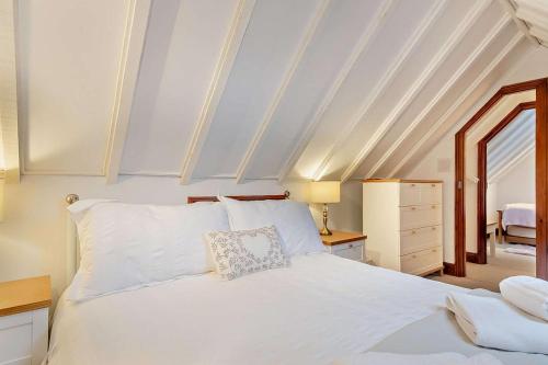 a bedroom with a white bed and a window at 2 Bed in Bodham oc-m15008 in Bodham