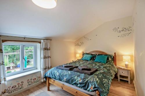 a bedroom with a bed and a window at 2 Bed in Bodham oc-t27775 in Bodham