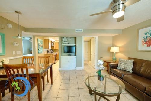 a living room with a couch and a table at Windy Hill Villa 3 - Beach Charm in Myrtle Beach