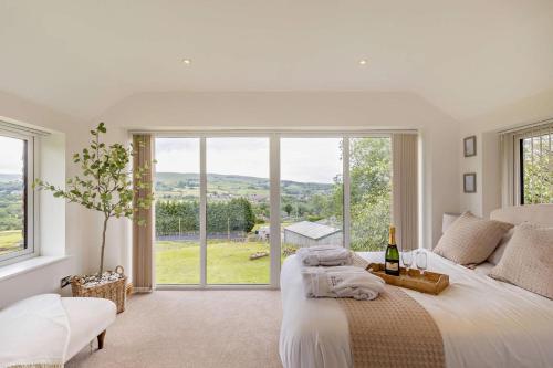 a bedroom with a large bed and a large window at 1 Bed in New Mills oc-p29603 in Mellor