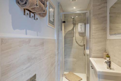 a bathroom with a shower and a sink at 1 Bed in New Mills oc-p29603 in Mellor
