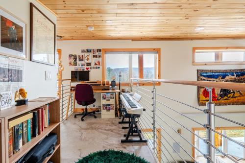 a home office with a desk and a baseball bat at Modern Cabin near Watkins Glen in Alpine