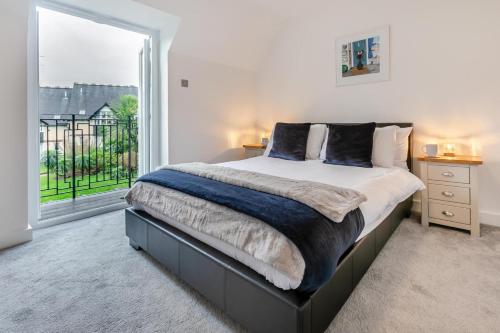 a bedroom with a large bed and a large window at 3 Bed in St. Ives oc-c30315 in Carbis Bay
