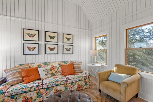 a living room with a couch and a chair at Boots to Beach in Duck