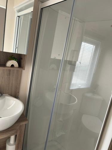 a bathroom with a shower and a sink at Sunset retreat in Crowle