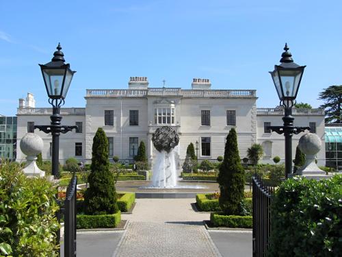 a white building with a fountain in front of it at St Helens Hotel, Dublin in Stillorgan