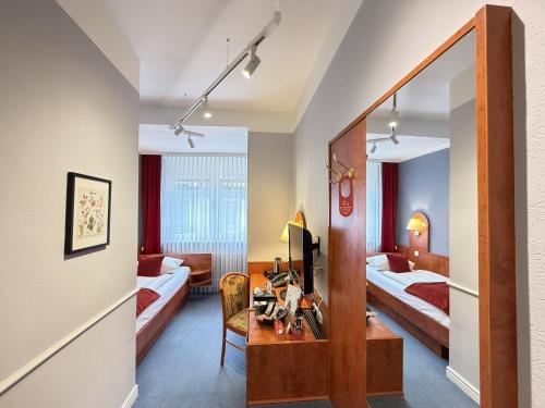 Säng eller sängar i ett rum på Hotel West an der Bockenheimer Warte