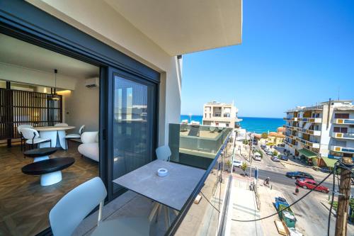 a balcony with a view of the ocean at Allegro Suites in Rethymno