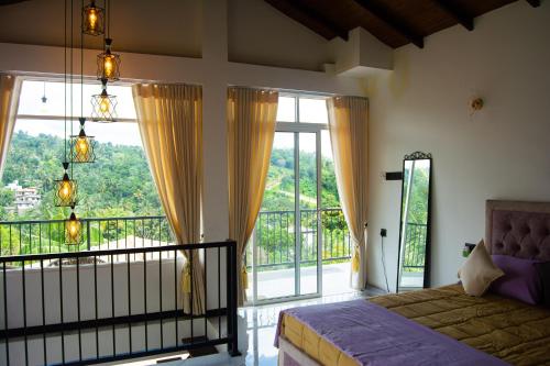 a bedroom with a bed and a balcony with windows at Mulberry villa in Kandy