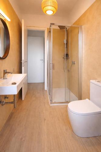 a bathroom with a shower and a toilet and a sink at Bella Vista Baveno in Baveno