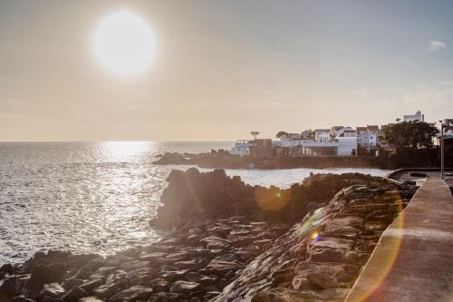 a view of the ocean from a rocky shoreline at GuestReady - Sea Escape Azores in Lagoa