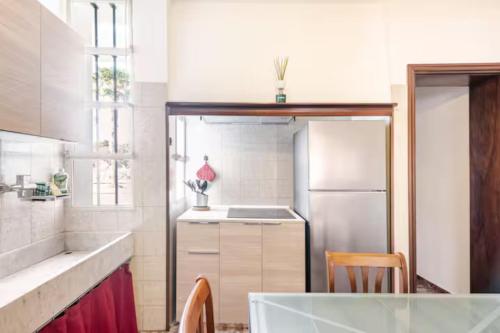 a kitchen with a sink and a refrigerator at "Venetian Elegance Villa" - near Venice historic center in Mira