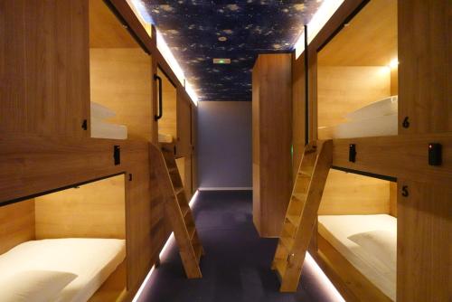 a group of bunk beds in a room at The POD Suite Hostel Joaquin Sorolla in Valencia