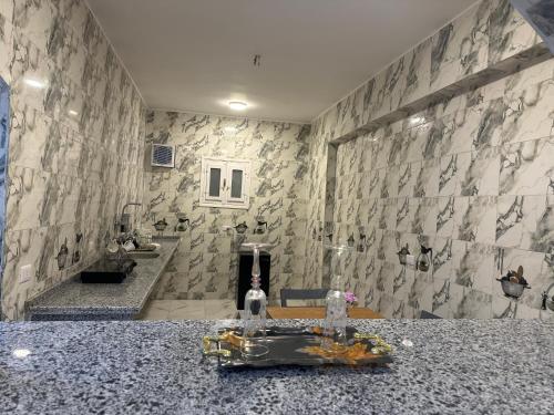 a bathroom with a sink and a counter at golden house in Al Aqālitah