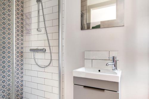 a white bathroom with a sink and a shower at 3 Bed in Hindolveston oc-1986 in Hindolveston