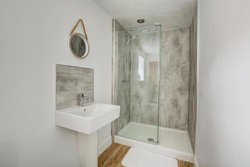 a bathroom with a sink and a shower at 2 Bed in Blakeney oc-1805 in Blakeney