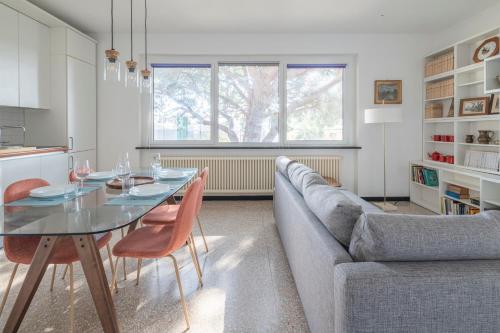 a living room with a table and a couch at Torre Dell'Amore, Genova, Seaview in Genoa