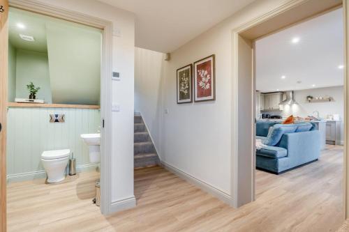 a bathroom with a toilet and a blue couch at 2 Bed in Castleton oc-f34013 in Castleton
