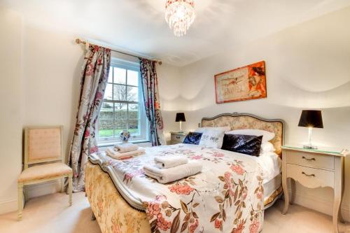 a bedroom with a bed with pillows on it at 2 Bed in Beadnell oc-gd1869 in Beadnell