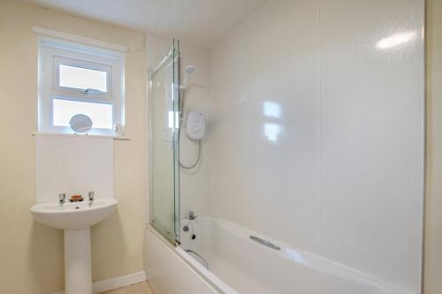a bathroom with a shower and a sink and a toilet at 2 Bed in Berwick-upon-Tweed oc-gd1871 in Ancroft