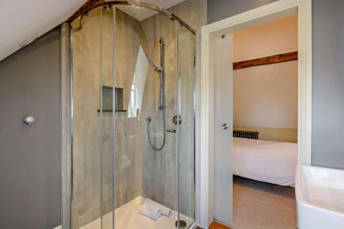 a shower with a glass door in a bathroom at 2 Bed in Blythburgh oc-t27735 in Blyford
