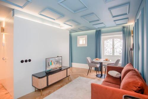 a living room with a couch and a table at Liiiving in Porto - Ribeira Design Apartment in Porto