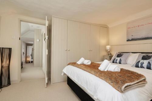 a bedroom with a large white bed with a blanket at 3 Bed in Dalwood oc-p27362 in Dalwood