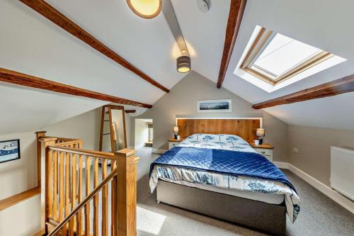 a bedroom with a bed and a skylight at 1 Bed in Dyffryn Ardudwy oc-g29349 in Dyffryn