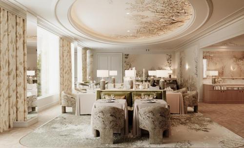 a salon with a table and chairs in a room at Relais d'Amboise - The Leading Hotels of the World in Amboise