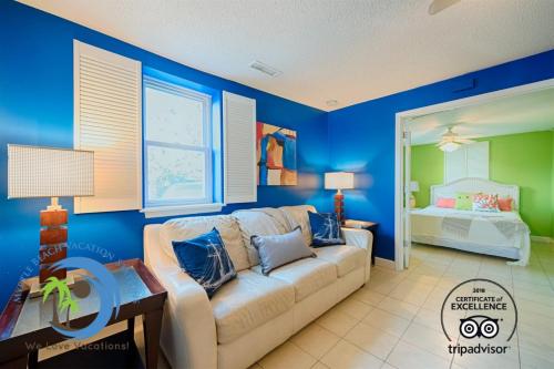 a living room with a couch and a bedroom at Windy Hill Villa A in Myrtle Beach