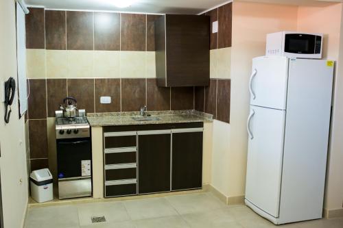 Η κουζίνα ή μικρή κουζίνα στο Apart Hotel Lo de Carilo