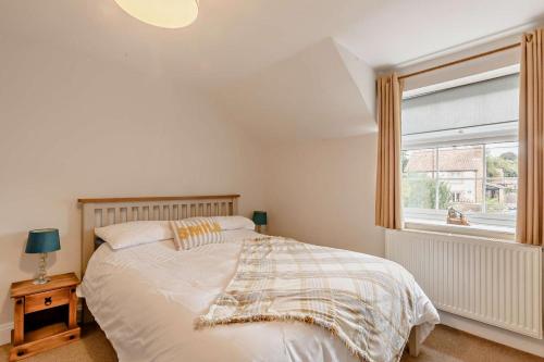 a bedroom with a large bed and a window at 2 Bed in Dersingham oc-p28040 in Dersingham