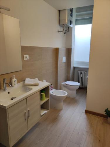 a bathroom with a sink and a toilet at Torino Comfort 10 in Turin