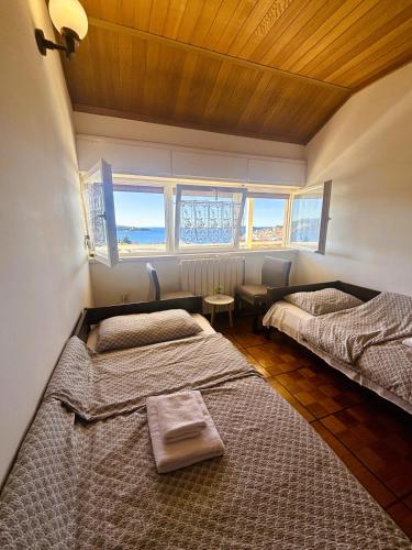 Llit o llits en una habitació de Vila Primo