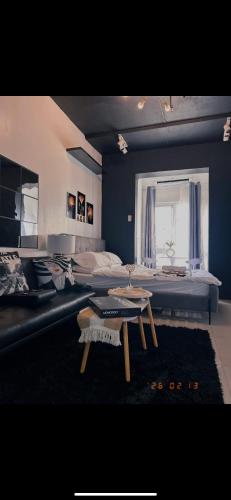 a large bedroom with a bed and a table at A&R Haven in Manila