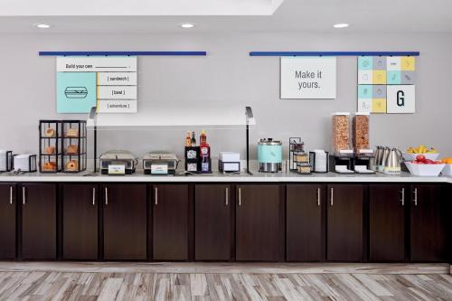 a kitchen with a counter top with some food at Garner Hotel Mazatlan Beach by IHG in Mazatlán