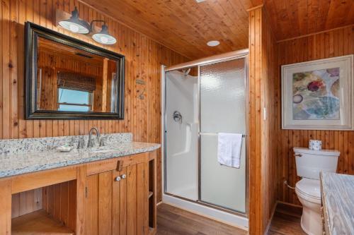 a bathroom with a shower and a toilet at NH330 It's Beach Time in Nags Head