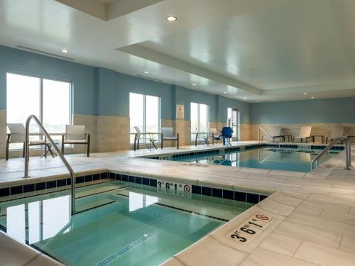 a large swimming pool with two lanes in a building at Holiday Inn Express & Suites - Meridian - Boise West by IHG in Meridian