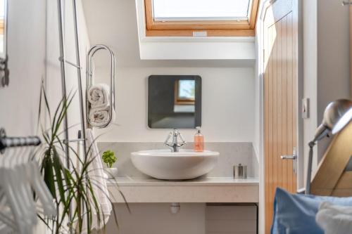 a bathroom with a sink and a mirror at 2 Bed in Horns Cross oc-l29271 in Bucks Mills