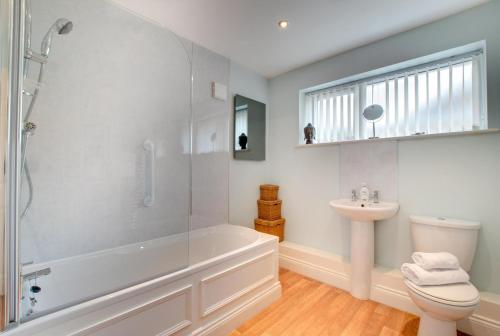 a bathroom with a shower and a toilet and a sink at 1 Bed in Belford oc-nb677 in Belford
