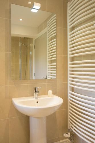 a bathroom with a sink and a mirror at 3 Bed in Low Row oc-ds1030 in Gunnerside