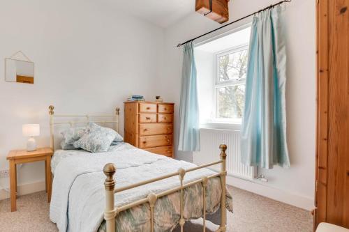 a bedroom with a bed and a window at 3 Bed in Bainbridge oc-ds1026 in Bainbridge