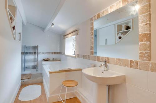 a white bathroom with a sink and a mirror at 3 Bed in Bainbridge oc-ds1026 in Bainbridge